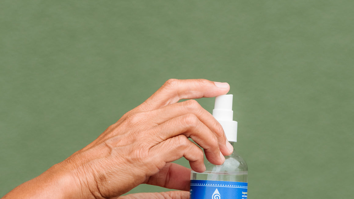 Woman's hands holding Magnesium Spray