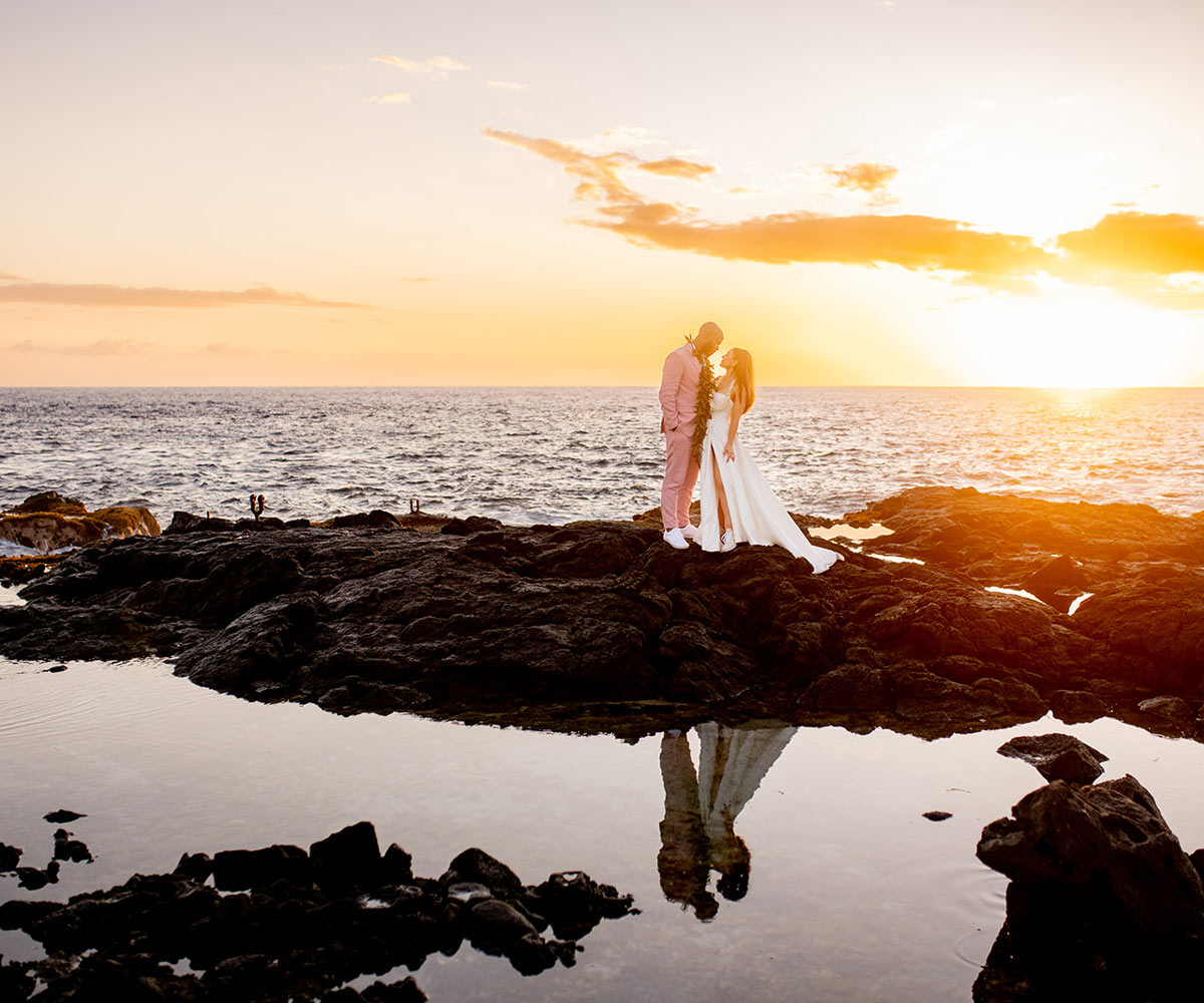 Couple on Rocks During Sunset