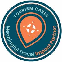 Logo of Tourism Cares with a blue circular border and orange icon.