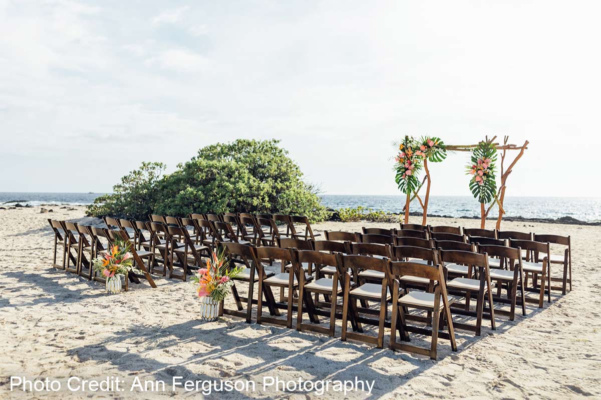 Ceremony chairs on sand with ocean view