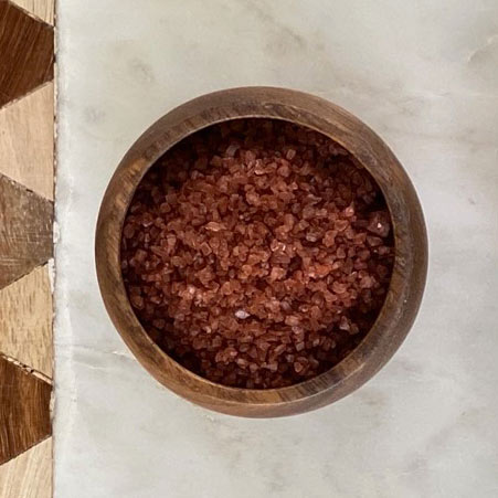 Alaia red clay Hawaiian sea salt in wooden bowl