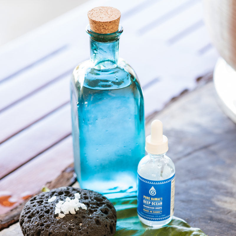 Deep Ocean Magnesium Water Drops with a chilled glass bottle of water