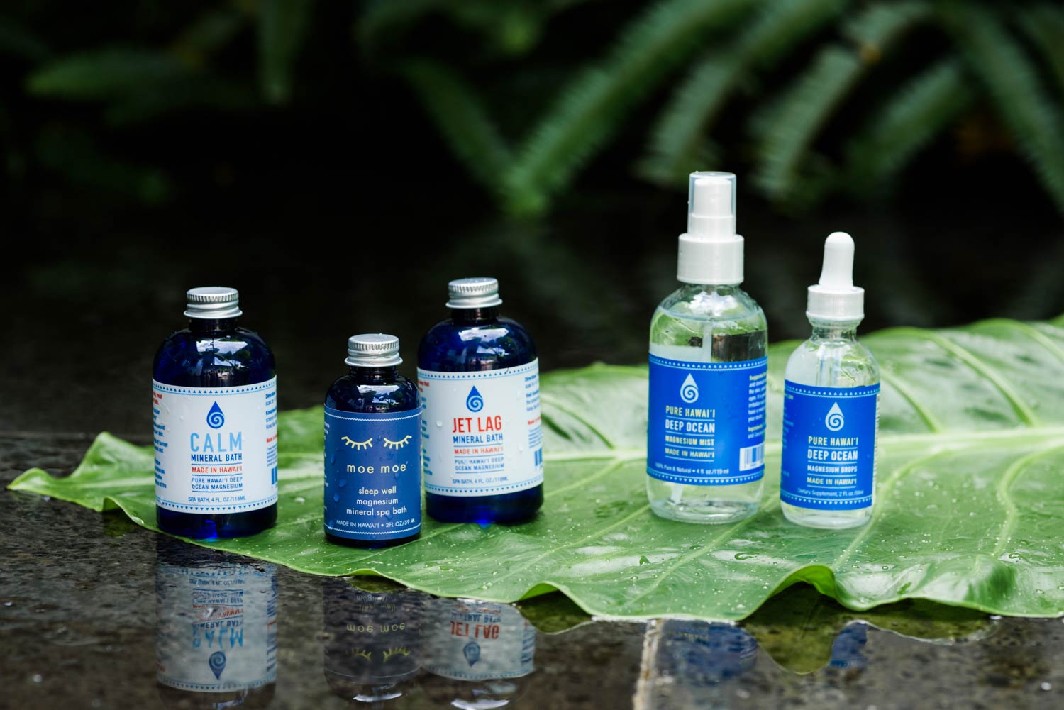 Magnesium bottles on a leaf with a blurred green background