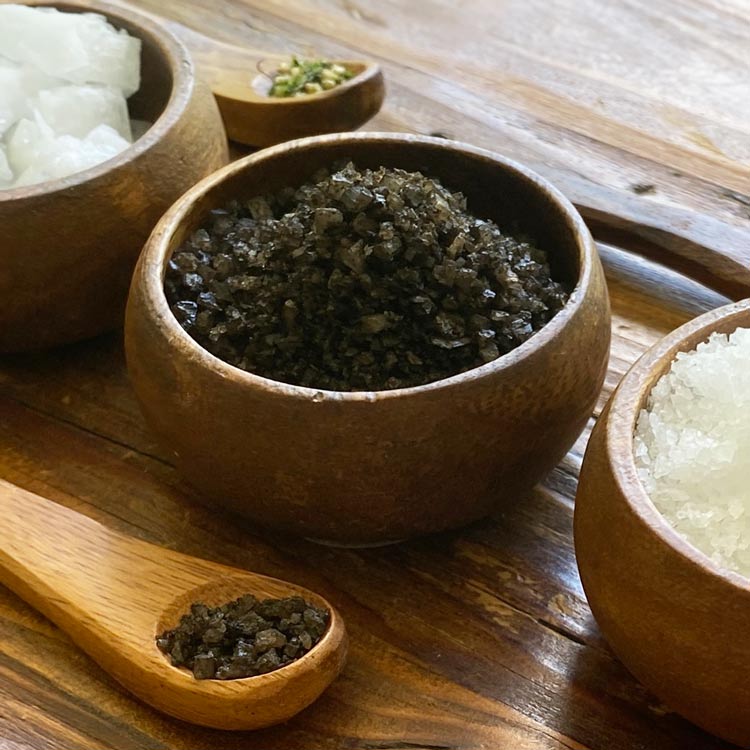 Uahi black Hawaiian sea salt in wooden bowl